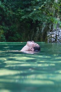 Portrait of woman swimming in pool