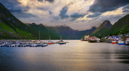 Scenic view of sea and mountains against sky