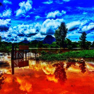 Scenic view of sea against cloudy sky