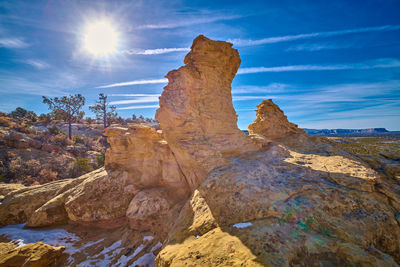 Rock formations on mountain against sky