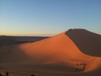 Scenic view of desert against clear sky