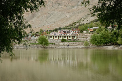 Scenic view of lake and houses in town