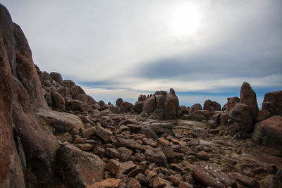 Low angle view of rock formations against sky