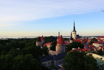 Cityscape against sky at sunset