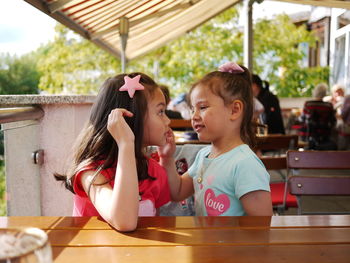 Mother and son on table
