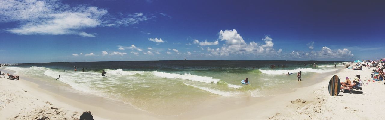 beach, sea, water, shore, sand, horizon over water, sky, scenics, beauty in nature, wave, tranquil scene, tranquility, surf, nature, incidental people, blue, coastline, vacations, idyllic, panoramic