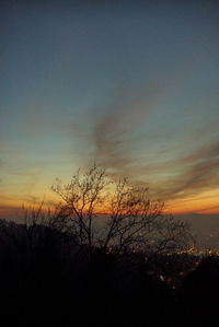 Silhouette tree against sky at sunset