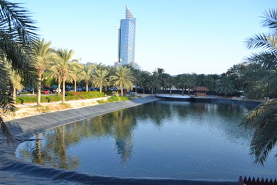 Swimming pool by sea against clear sky