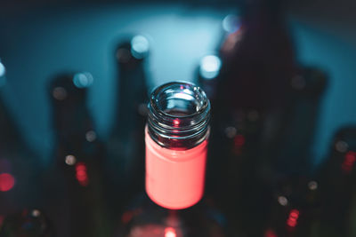Close-up of drink in glass on table at night