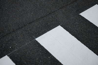 High angle view of arrow sign on road