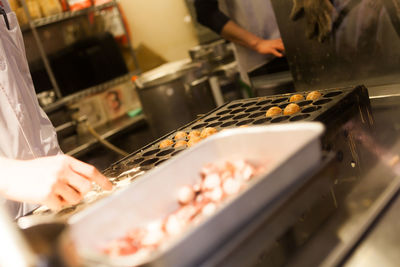 Close-up mid section of preparing street food