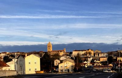 View of buildings in city against sky