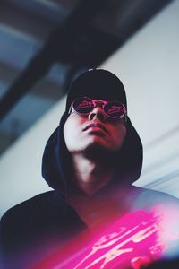 Close-up portrait of woman wearing sunglasses