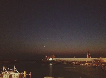 View of illuminated sea at night