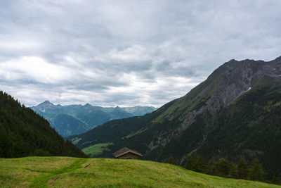 Hiking trails through green fields in the alps