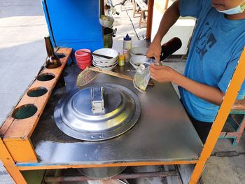 High angle view of man working in water