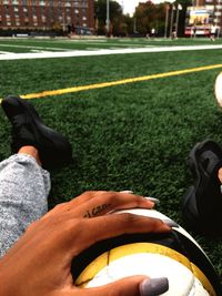 Low section of man relaxing on grass