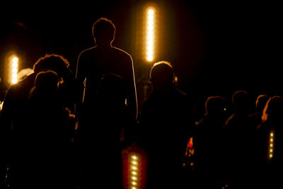 Silhouette people enjoying at concert