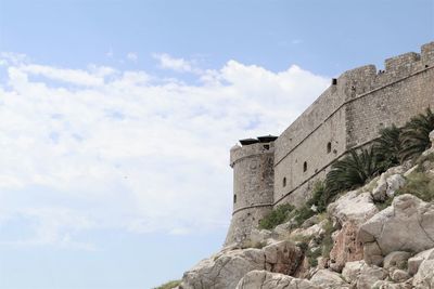 Low angle view of fort against sky