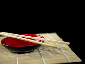 Close-up of dessert on table against black background