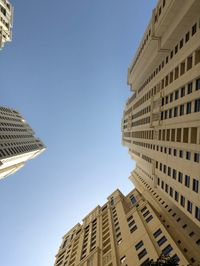 Low angle view of buildings against clear sky