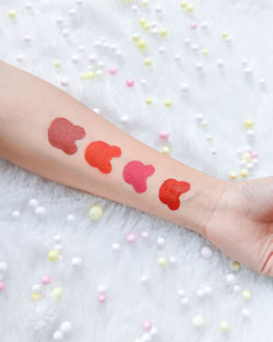 Close-up of woman hand on white fabric