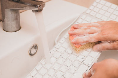 Cropped hands of person washing hand