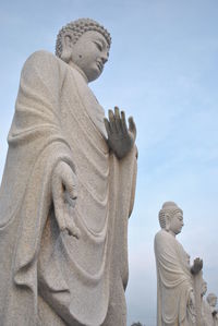 Low angle view of statue against sky