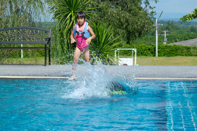 Full length of woman swimming in pool