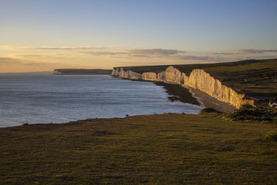 Scenic view of sea against sky at sunset