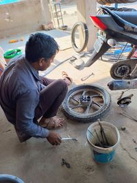 Side view of man working at construction site