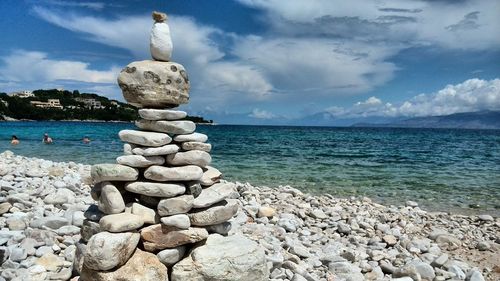 Scenic view of sea against cloudy sky