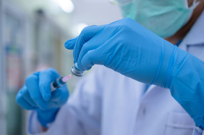 Close-up of human hand holding umbrella