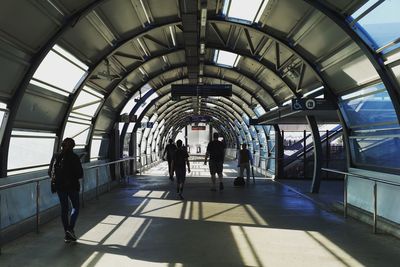 People walking at railroad station