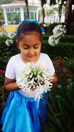 Close-up of girl holding flowers