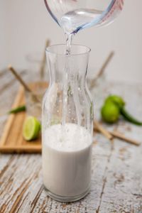 Close-up of water pouring into drink