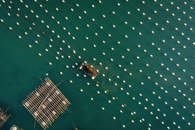 Aerial view of wooden raft on sea 