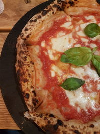 High angle view of pizza served on table