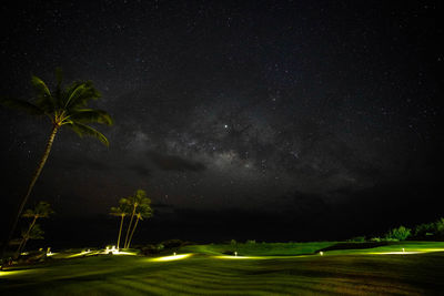 Scenic view of field against sky at night