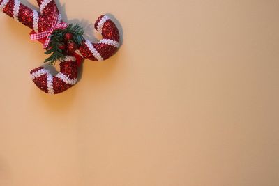 Close-up of christmas decoration hanging on wall