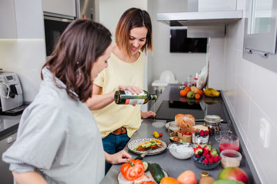 Women preparing food at kitchen