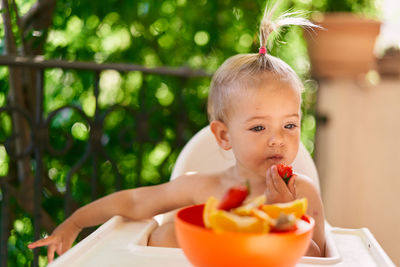 Portrait of boy eating food