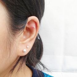 Cropped image of woman wearing earrings