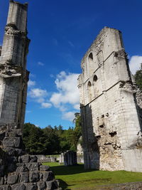 Low angle view of old ruins against sky