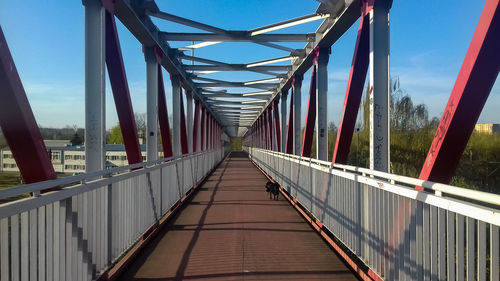 Bridge over footbridge against sky