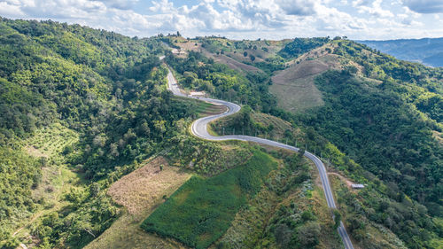 High angle view of road amidst mountains