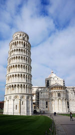 Low angle view of historical building against cloudy sky