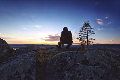 Man standing on rock formation