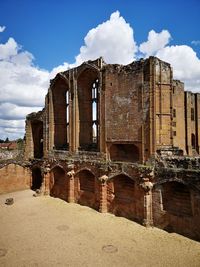 Old building against cloudy sky