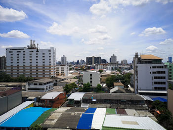 High angle view of buildings in city against sky